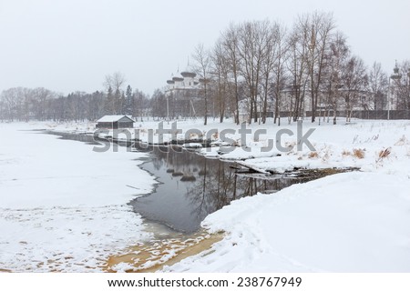 Winter landscape in the northern Russian city in the snowfall. Kargopol city on the shore of the Onega River