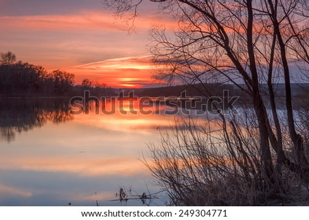 Spring landscape on the river in flood in after sunset colors. Kama River, Tatarstan, Russia