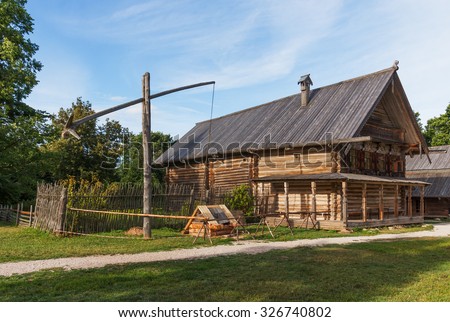 Old wooden hut in the village on a summer day. Museum of Wooden Architecture Vitoslavlitsy around Veliky Novgorod