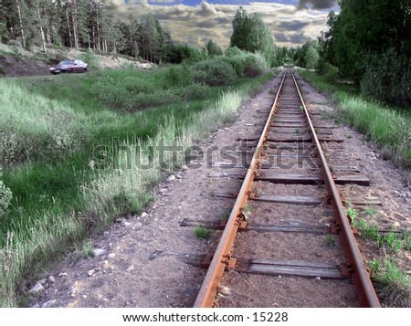 The old rusty rails next to the mean of transportation that replaced it.