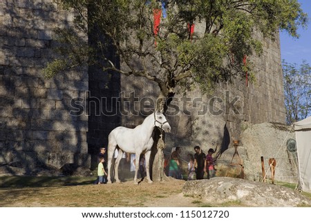 GUIMARAES, PORTUGAL - SEPTEMBER 16: Medieval themed fairs;horse activities centered around the Medieval period at FEIRA AFONSINA, on September 16, 2012 in Guimaraes, Portugal