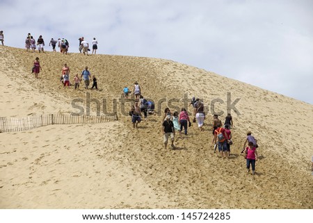 PYLA SUR MER, FRANCE - AUGUST 8: People visiting the Famous dune of Pyla, the highest sand dune in Europe, on August 8, 2012 in Pyla Sur Mer, France.