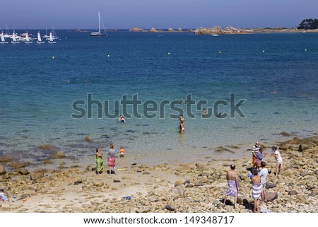 PORT-BLANC, BRITTANY, FRANCE - AUGUST 10: People at the beach, on August 10, 2012 in Port-Blanc, Brittany, France.