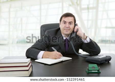 young business man writing on a desk