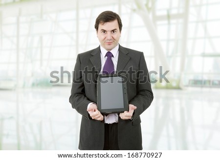 businessman showing a tablet pc at the office