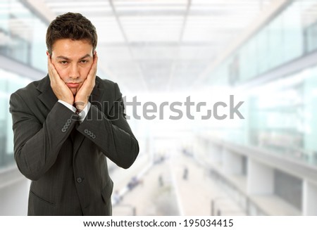 Businessman with a headache at the office