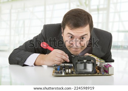 Computer Engineer working in a motherboard at the office