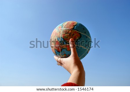 hand with a globe