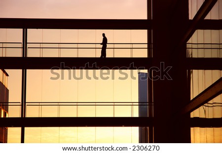 worker alone in the modern building in sepia tone
