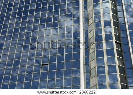 modern mirror building detail and the sky