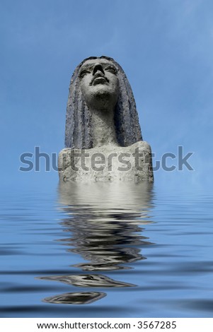 woman stone statue with lake water reflection