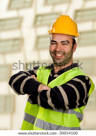 happy young worker inside a modern building