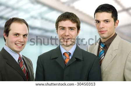 three happy business men together as a team