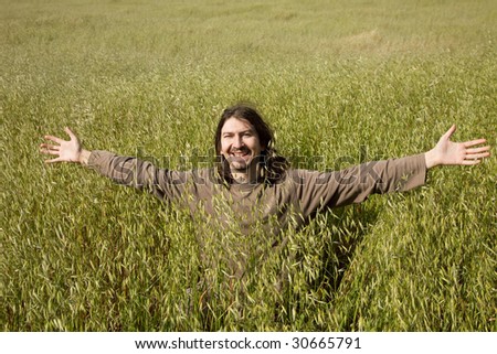 happy ugly casual man having fun at a field