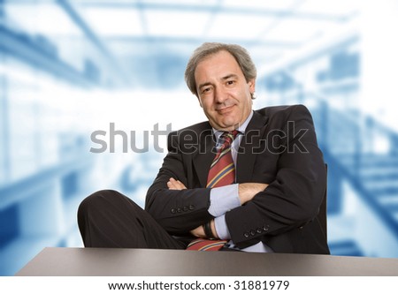 happy mature business man working on a desk