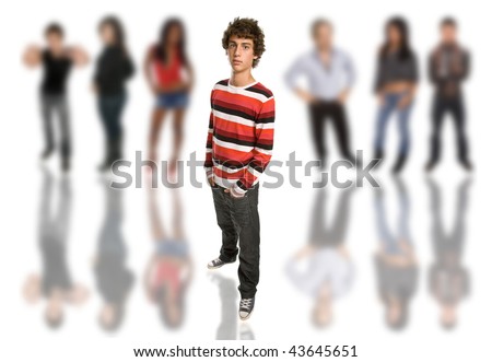 young casual boy full body, among some out of focus people