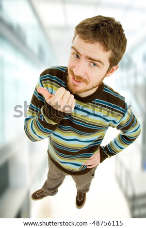young casual man full body going thumb up
