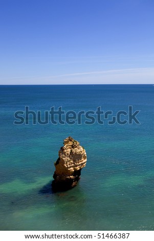rock at the ocean from above, algarve, portugal
