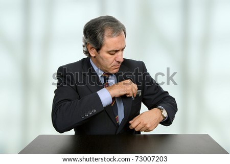 worried mature business man on a desk at the office