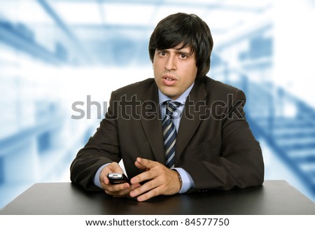 young worried business man on a desk, at the office