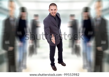 young business man full body offering his hand