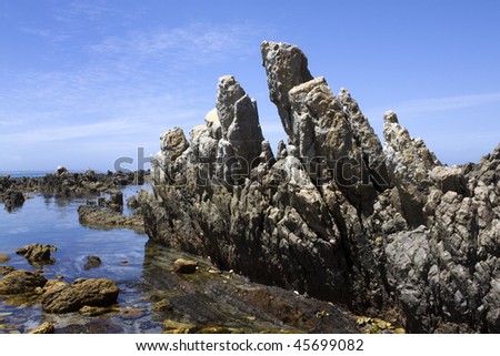 Jagged rocks in the Atlantic Ocean at Kleinmond in the Western Cape Province of South Africa