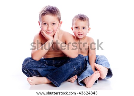 Young boys seating together isolated on white background