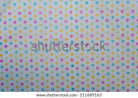 Colored dots on white background with selective focus. Title:  Colorful Dots