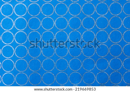 Description:  Blue background with silver radiant circles. Title:  Bluer backdrop with silver circles.