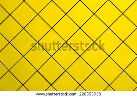 Description:  Golden yellow tiles in an geometrical pattern. Title:  Geometrical Yellow Tile Pattern.