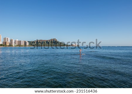 Description:  Stand up Paddler  at Waikiki Beach with Diamond Head background. Title:  Diamond Head