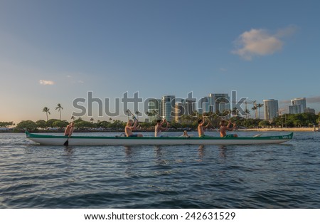 Honolulu, Jan. 06:  As the sun sets at the stern of an outrigger canoe as the team practices for the Hawaii State Outrigger Canoe Championship.  Honolulu, Hawaii, USA.  Jan. 06, 2015.