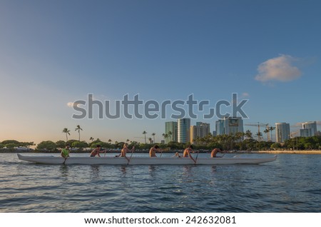 Honolulu, Jan. 06:  The sun is low on the horizon as an outrigger canoe team practices for the Hawaii State Outrigger Canoe Championships.  Honolulu, Hawaii, USA.  Jan. 06, 2015.