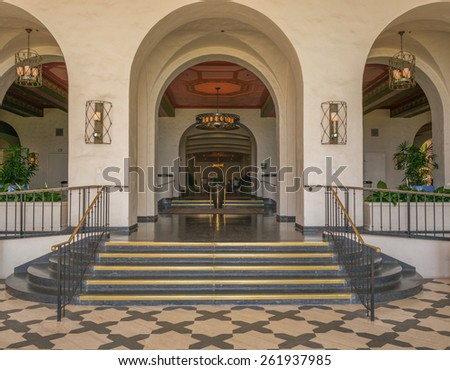 Honolulu, Hawaii, USA, March 19, 2015:  The historic Royal Hawaiian Hotel in Waikiki has restored the grand hallway with champagne white  walls, black and white tiles with gold trim.