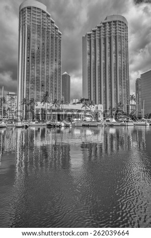 Honolulu, Hawaii, USA., March 19, 2015:  The twin towers of the newly renovated Hawaii Prince Resort on a cloudy spring day with the Ala Wai Harbor in the foreground.