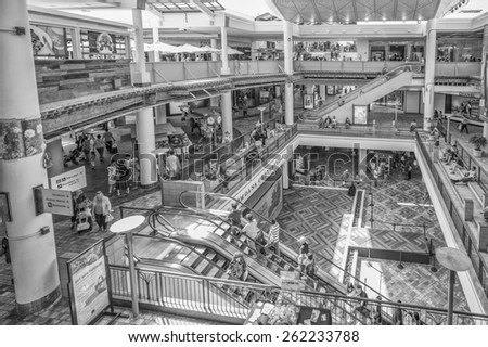 Honolulu, Hawaii, USA, March 20, 2015:  Ala Moana Center open interior stage with a new level nearing completion while shoppers carry on.
