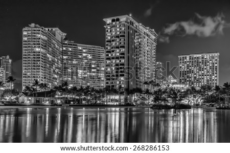 Honolulu,Hawaii, USA, April 12, 2015: Night wind storm at the Honolulu Lagoon with fast moving clouds and haze. Global warming has brought many changes to the normally predictable weather in Waikiki.