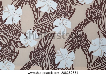 Vintage Hawaiian aloha shirt fragment with brown tattoo and white hibiscus pattern on a tan background.