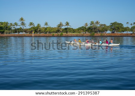 Honolulu, Hawaii, USA, June 28, 2015:  Women practicing outrigger canoe procedures for the State of Hawaii Outrigger Canoe Regatta.  Crews paddle together all year and race on the 4th of July.