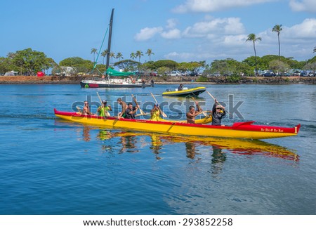Honolulu, Hawaii, USA, July 5, 2015:  Outrigger canoe, a water taxi, and a beach catamaran, cross paths in the State of Hawaii Ala Wai Harbor in Waikiki.  The Ala Wai Harbor is Hawaii\'s finest harbor.