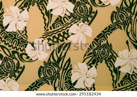 Retro Polynesian cloth pattern/texture with white plumeria flowers on a black jungle/tattoo pattern on a faded creme background.