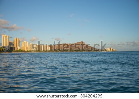 Honolulu, Hawaii, USA, August 8, 2015:  Dusk view of Waikiki with Diamond Head Crater in the background.  Diamond Head is Hawaii\'s best known symbol.