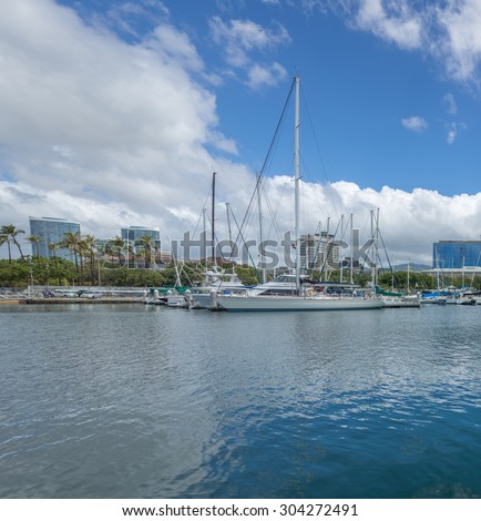 Honolulu, Hawaii, USA, August 8, 2015:  Morning view of a sleek ocean racing sailboat at Waikiki Yacht Club.  This sailboat finished the 2015 Transpacific Yacht Race in record time.