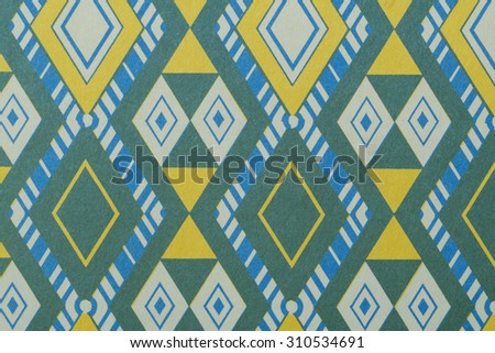 Vintage cotton cloth fragment with pattern from an Aloha shirt in tones of blue, green, yellow, and white.