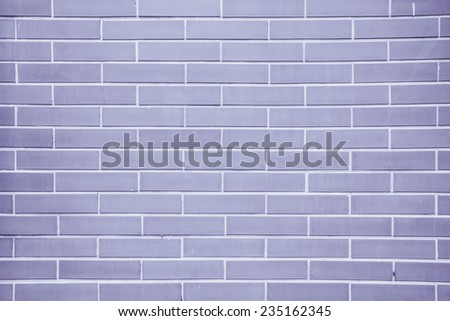 Purple brick wall suitable for a background.