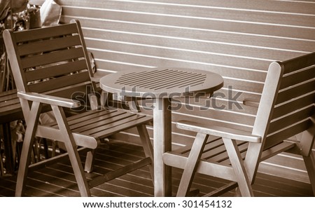 round table with wooden chair  to sit and wait