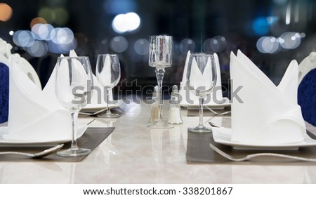 Bright luxury dining room with rich marble table with bokeh.