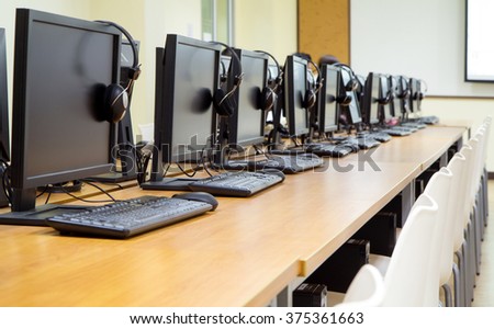 Group of computer neatly placed in a computer lab.