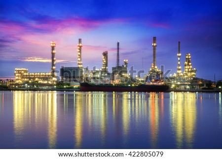 Oil refinery or petrochemical industry with ship at twilight in thailand. for Logistic Import Export background