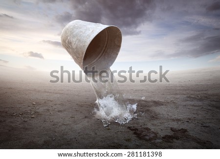 Pail with water on beautiful ground background
